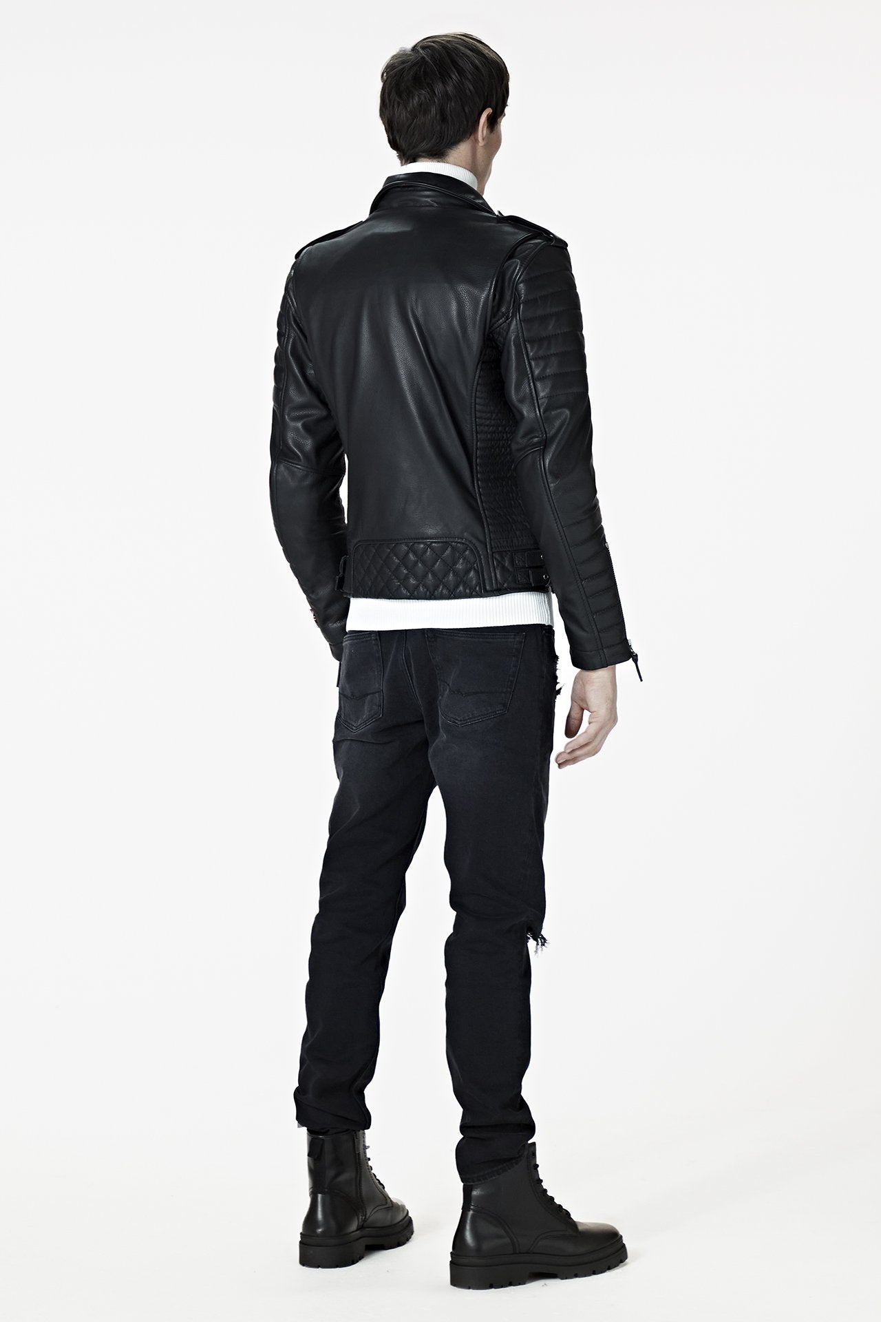A male model wearing our Men's Black Leather Biker Jacket - Kay Michaels: biker protection from the BODA SKINS biker collection. back facing.